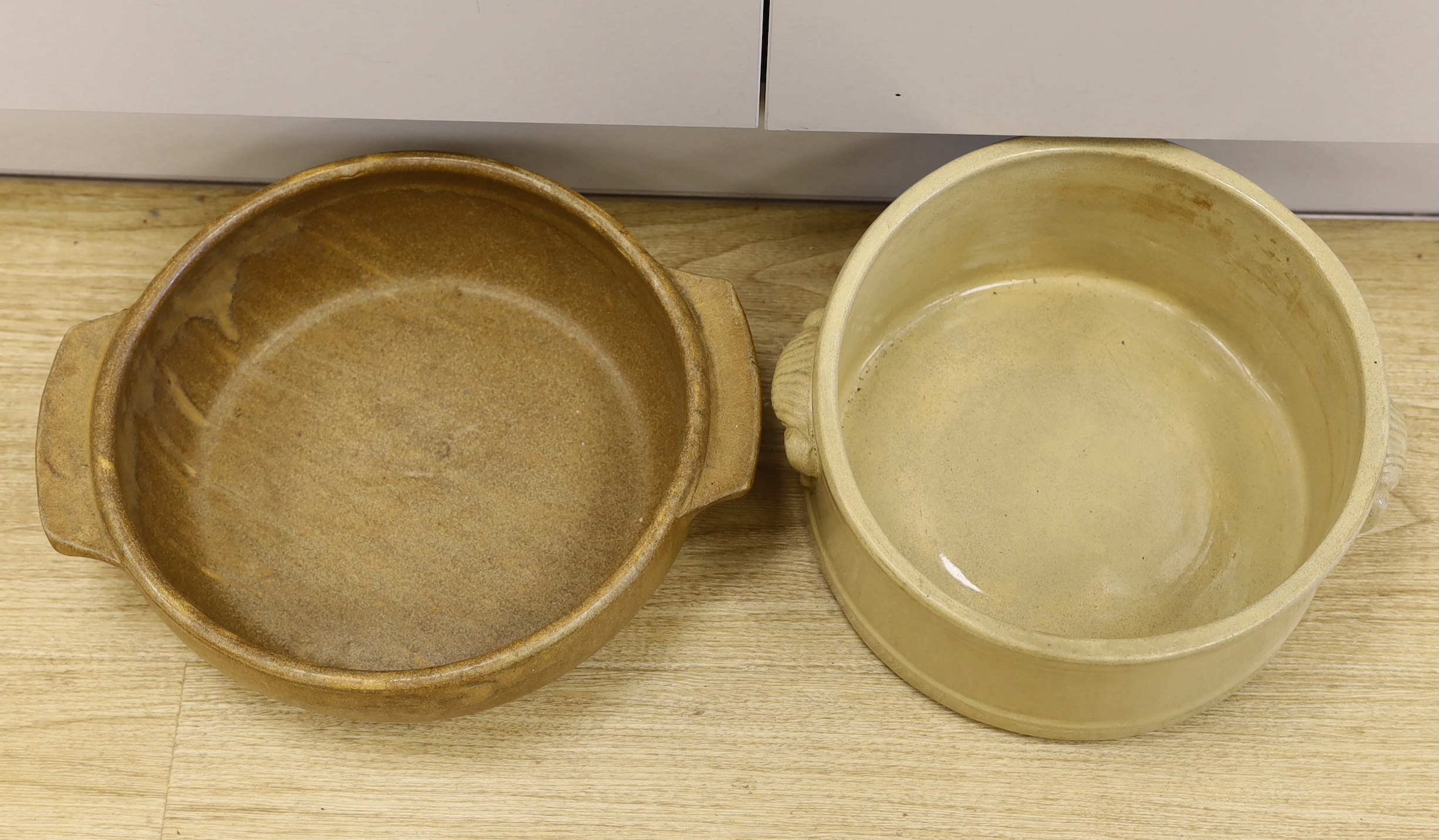 Two circular stoneware bowls including a Moira Pottery example with stamp to the base, the largest 38cm wide